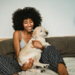 Dog playing inside with mom